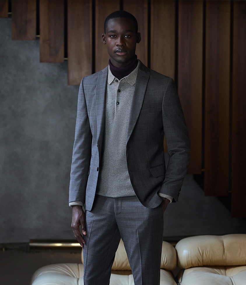 Business Style Mann in hellgrau karierten Business Anzug